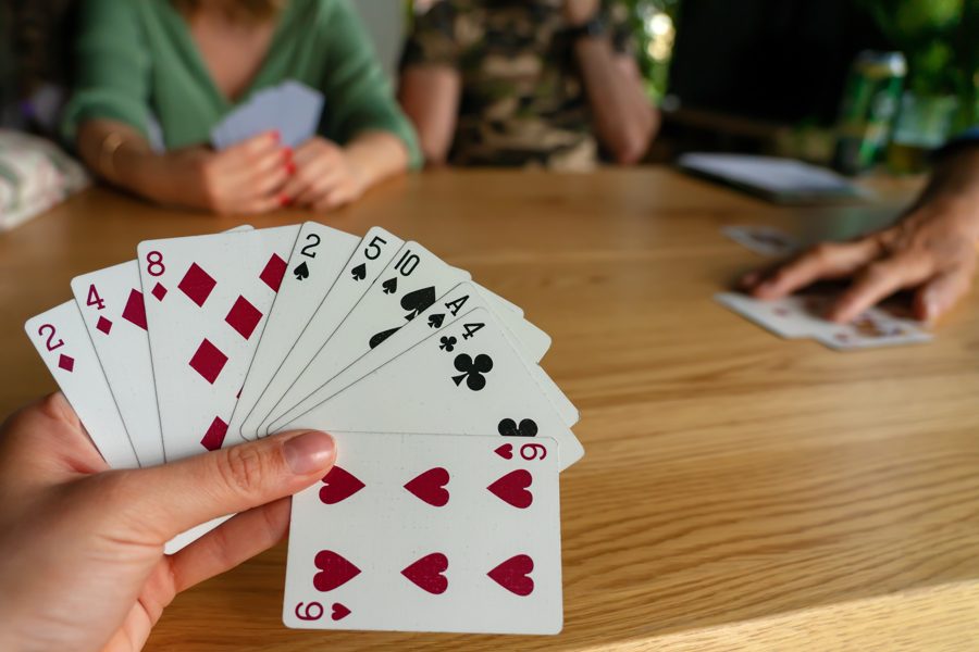 Friends around a table on game night